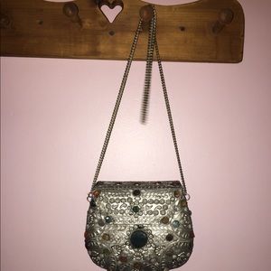 Metal long chain cross body bag.